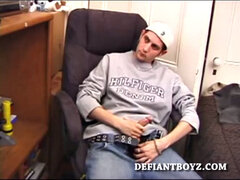 As a porn flick plays, young amateur Aaron Michaels strokes hard, pulls his cock out of his jeans, lets loose, and spills his nut on the bed.