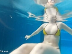 Jeny Smith enjoys a daring bottomless Spa session - swimming naked underwater with her natural tits on display