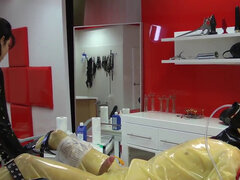 Slave in latex is bound and tortures by a depraved mistress