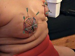 The nipples from the SKLAVIN-Z decorated with needles