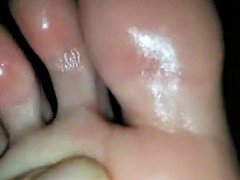 Candid Latina soles foot massage with lotion, shiny soles