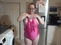 Wife with milk sacks dancing in swimsuit