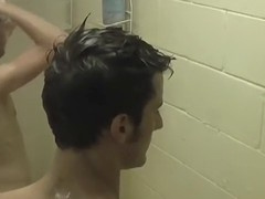 Skinny jocks give each other handjobs in a steamy shower scene