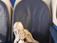 a young dude in blue denim sneakers and white socks jacks off on an empty teach in Milan