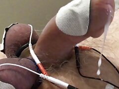 Long estim edging session with ball slapping brings out the cum