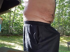 Jerking off outdoors in back yard cum shot public