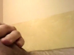 Obese uncut chap jerks off in ottoman, soft to hard and cum.