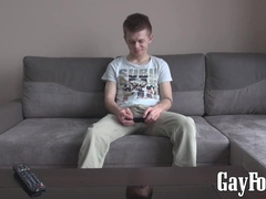 Tattooed twink Axel masturbates solo while watching porn