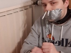 Bound and Smoking Hunk in Gay BDSM Action