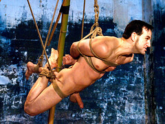Trying to find out his limits by being tied and suspended