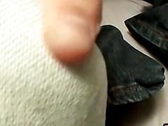 Tattooed jock teases with his feet and jerks off solo