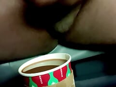 Black guy jerking off his black cock and cumming in coffee close up