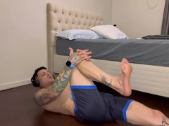 Beefy masculine doing gymnastics and tugging.