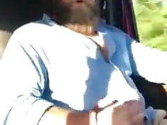 Bearded Trucker Jacks while Driving