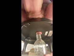 Beating my uncut cock while inserting a bottle in my hairy butthole, and a cumshot in your face.