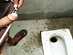 Big cock pissing in toilet room