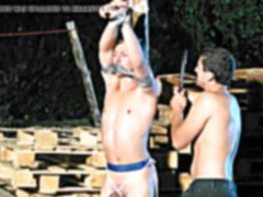 roped fellow made to suck trunk outdoors