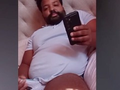 Bearded daddy bear indulges in playing with his thick black cock live