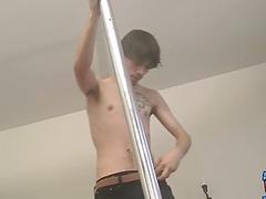 Hung twink performs a striptease before stroking his big cock