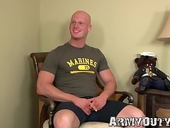 Bald marine Roman Eros shows off muscles before wank off