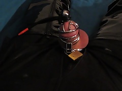 Slave in chastity cage and crotch boots cums
