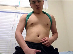 Taiwanese stud masturbating off in sports shorts