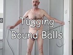 Tugging Bound Balls