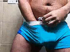 chubby man jerks AND CUMS IN SPEEDO! Thick jizz at the end.