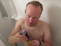 Blonde hunk gets steamy while stroking his dick in the shower