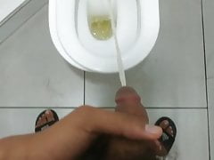 TEEN BOY PEEING IN TOILET.