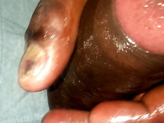 Stroking big black dick with coconut oil