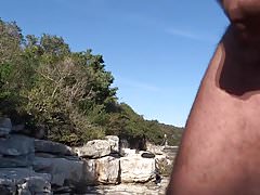 stroking on a rocky beach in Croatia