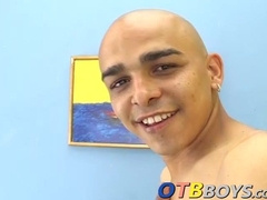 Kinky skinhead latino Cristobal is on the sofa wanking dick