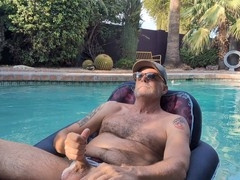 Gay pool, ballcap, poolside