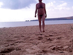 Walking naked out of the sea at nudist beach - Rockard Daddy