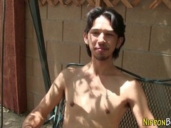 Asian twink strokes cock in the open air