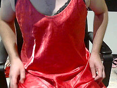 Crosssundresser with marvelous red dress and a lot of panty and boulder-holder