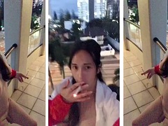 Beautiful shemale shows herself naked on the balcony while smoking