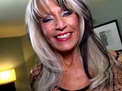 Experienced busty beauty Sally D'Angelo showcases her ample bosom