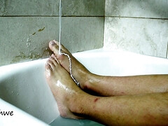 Feet warm in a bathtub with soap