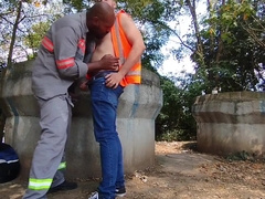 Employees plumbing bare behind the construction website