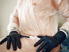 Getting hard while posing in plastic gown and latex gloves