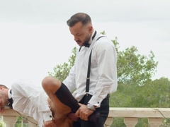 Horny men in suits pull out their dicks for a mutual moment in outdoor