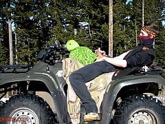 Biker fucks plush toy while on ATV four wheeler in the wilderness.