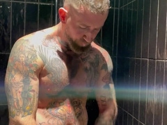 tattooed muscle stud Troy Daniels wanking off in the douche