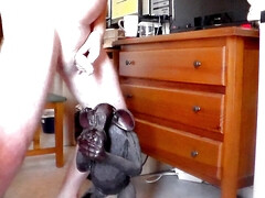 John is peeing on an ape statue