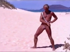 Tanned guy on beach in tiny string thong (temporarily!)