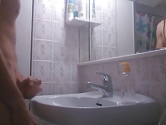Big cumshot makes the faucet to drip with cum