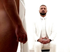 A man in a suit is banging the hell out of a petite lad