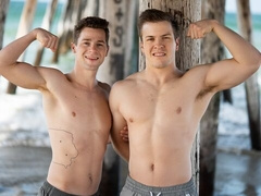 Cocky jocks Robbie and Clyde fuck anally on the bed